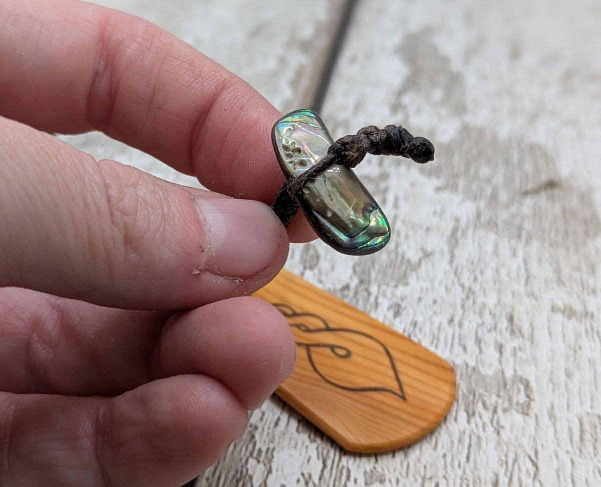 Yew wood pikorua laser printed bookmark with pāua abalone bead tassel.