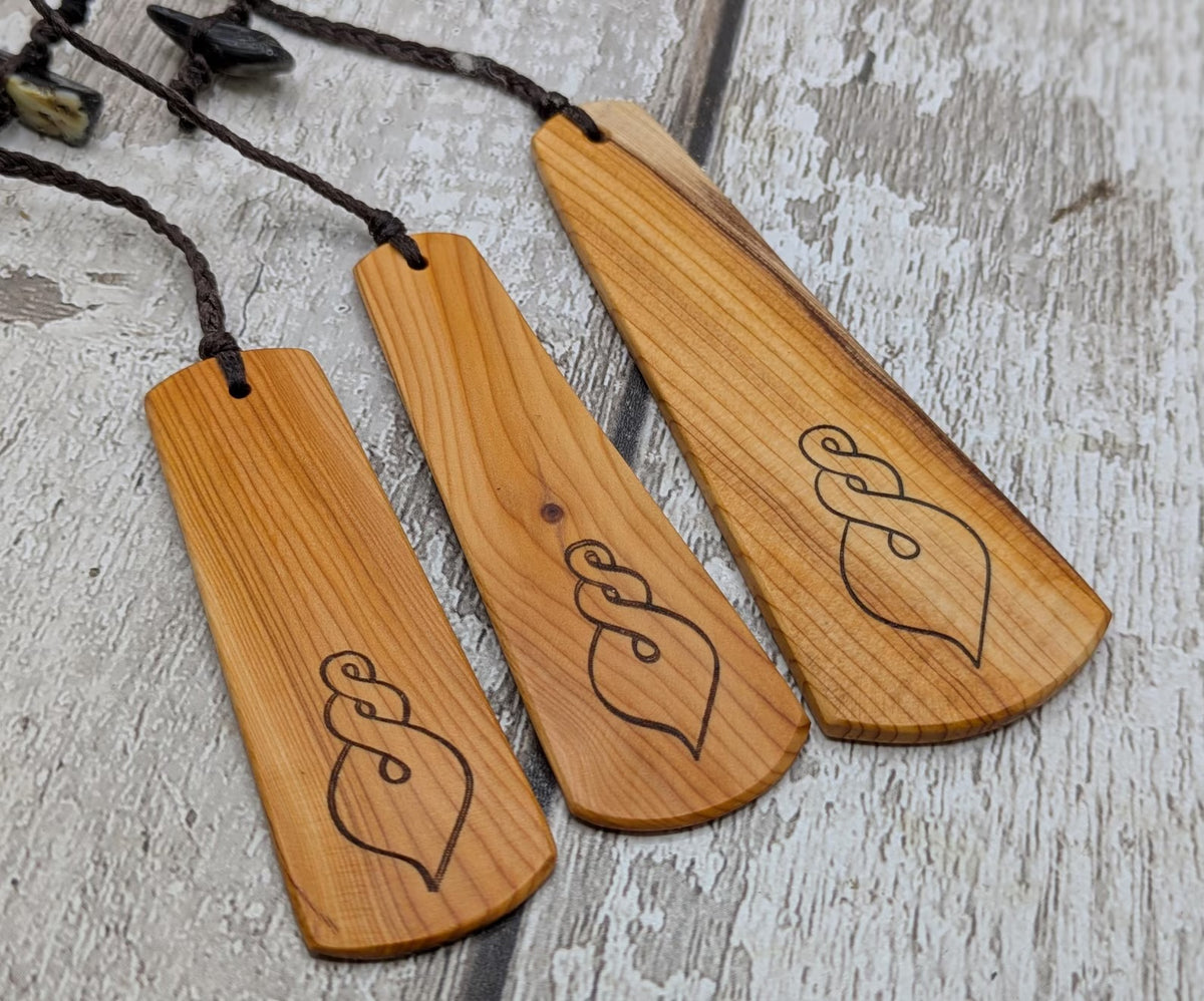 Yew wood pikorua laser printed bookmark with pāua abalone bead tassel.