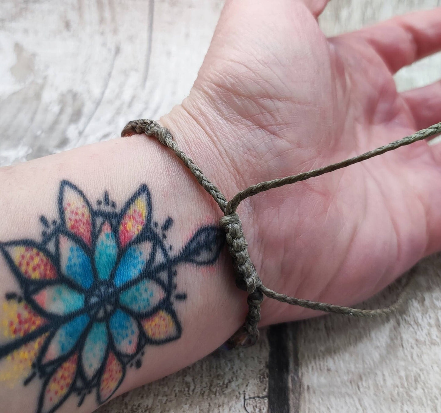 Glass bead macrame woven adjustable bracelet.