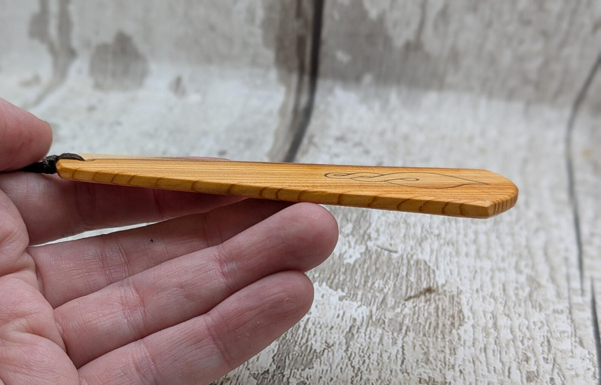 Yew wood pikorua laser printed bookmark with pāua abalone shell bead .
