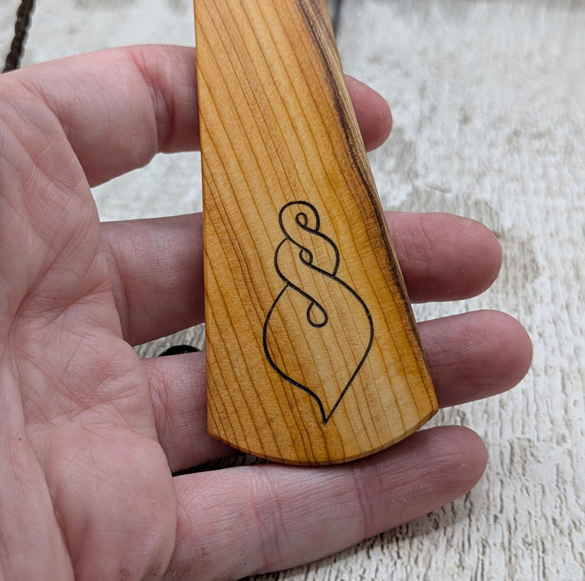 Yew wood pikorua laser printed bookmark with pāua abalone shell bead .