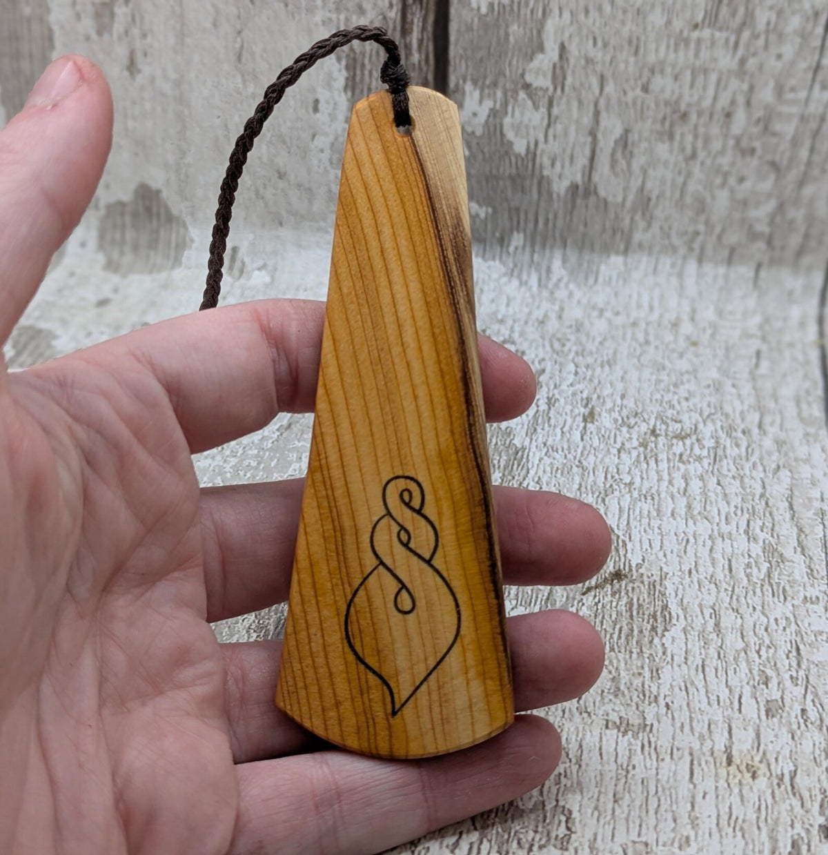 Yew wood pikorua laser printed bookmark with pāua abalone shell bead .