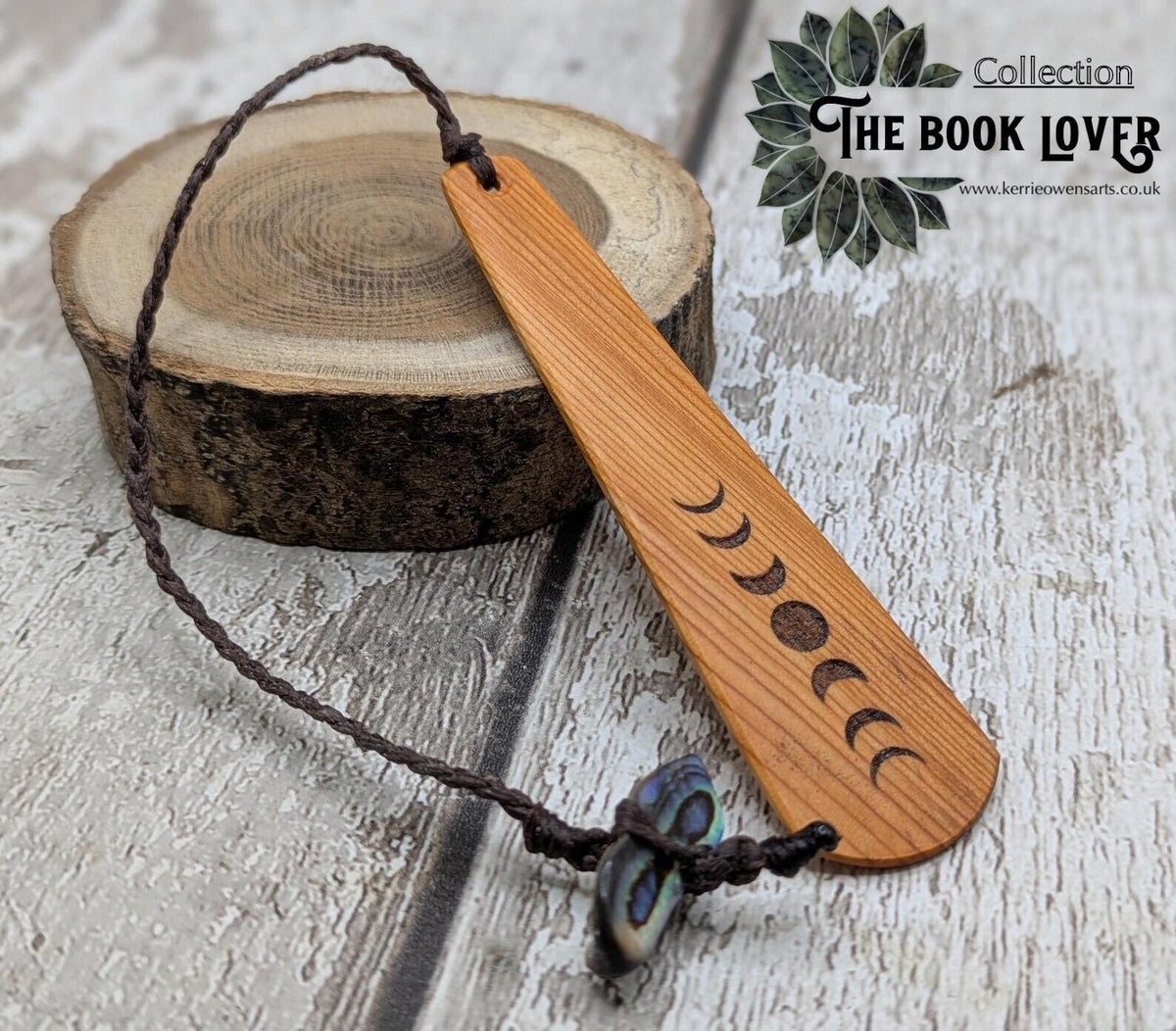 Yew wood with moon phrase laser print and abalone pāua shell bead tassel.