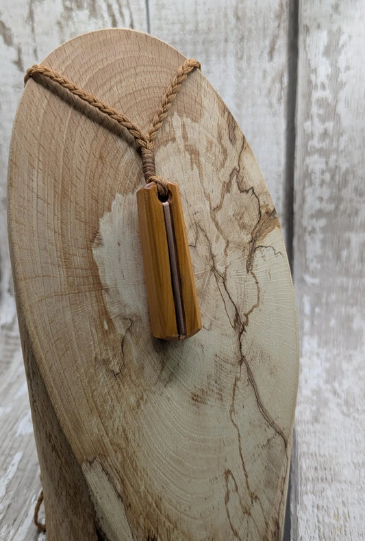 Yew wood roimata drop pendant with copper inlay.