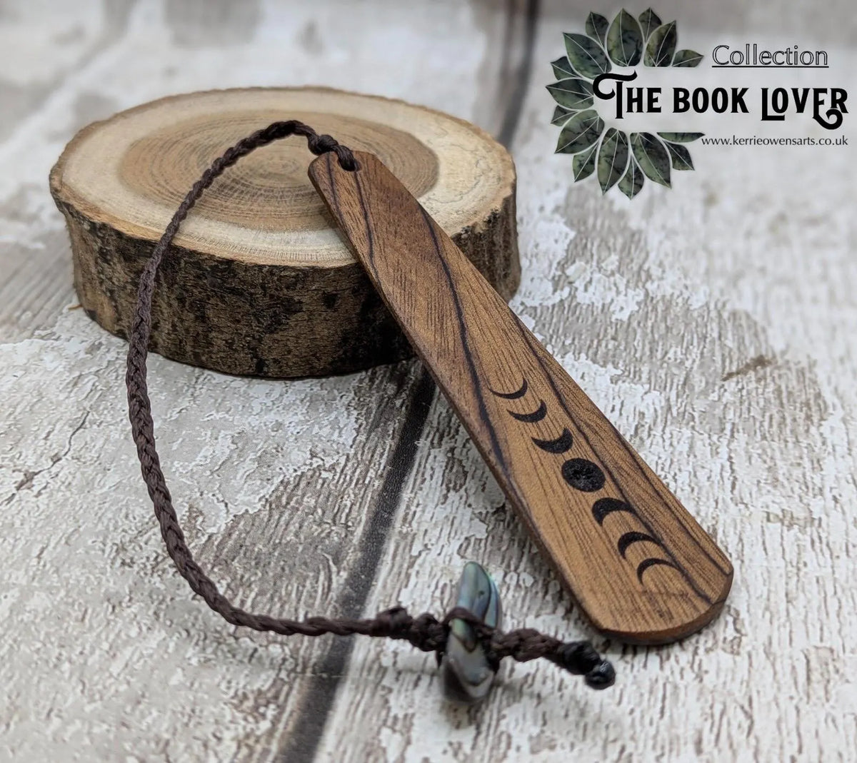Walnut wood moon phrase laser printed bookmark with pāua abalone shell bead tassel.