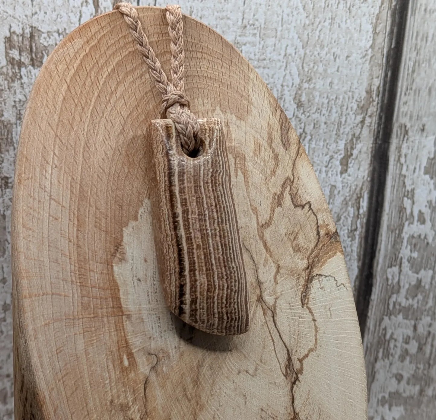Striped argonite Toki styled pendant.