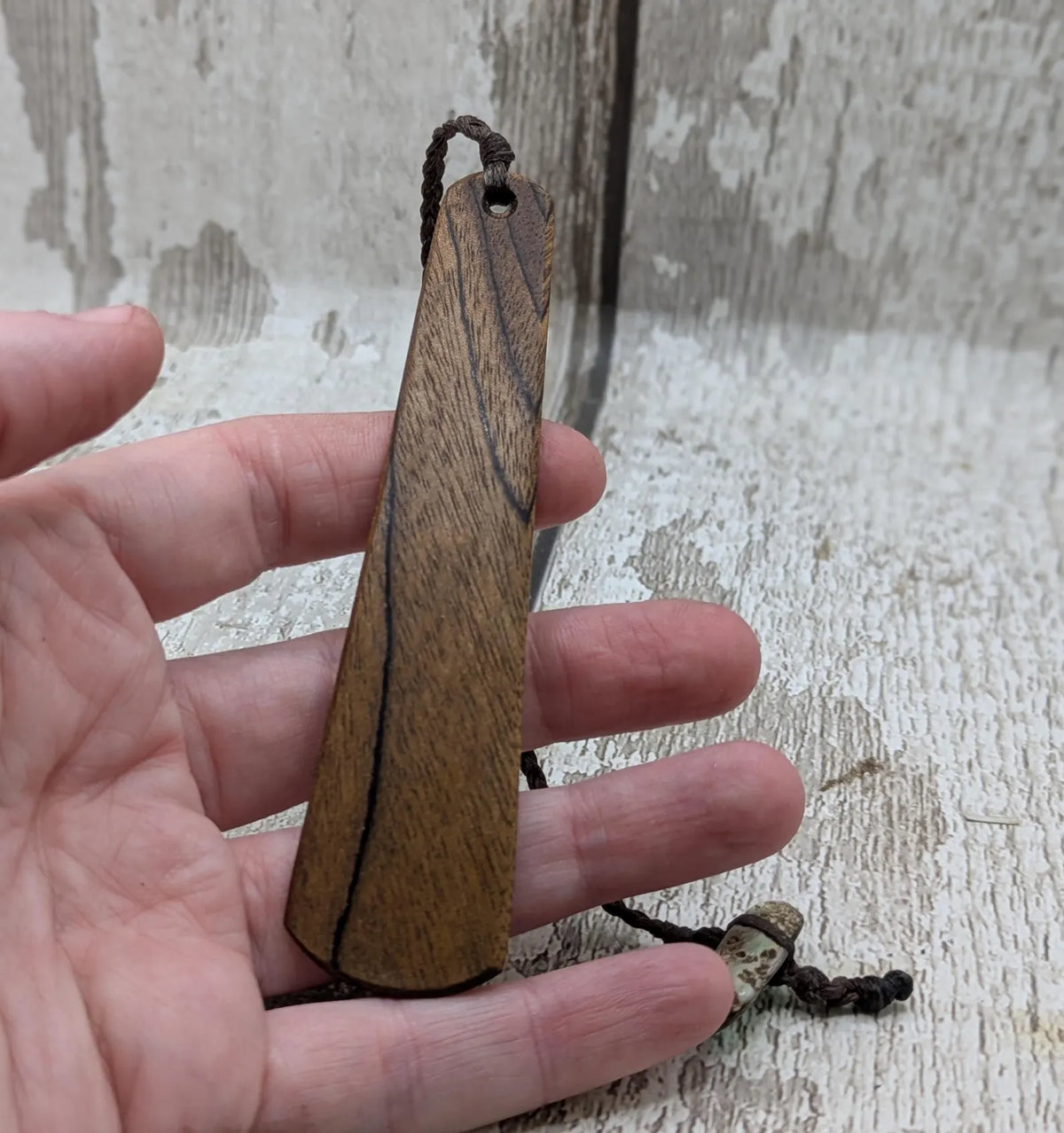 Walnut wood moon phrase laser printed bookmark with pāua abalone shell bead tassel.