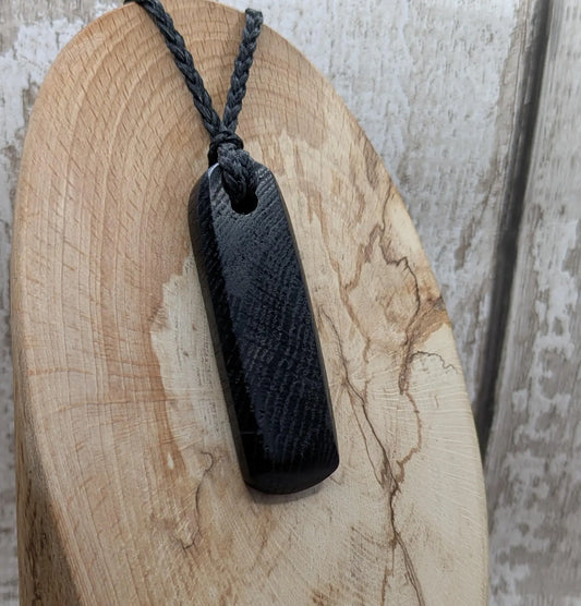 Bog oak hand carved Hei Toki adze unisex pendant.