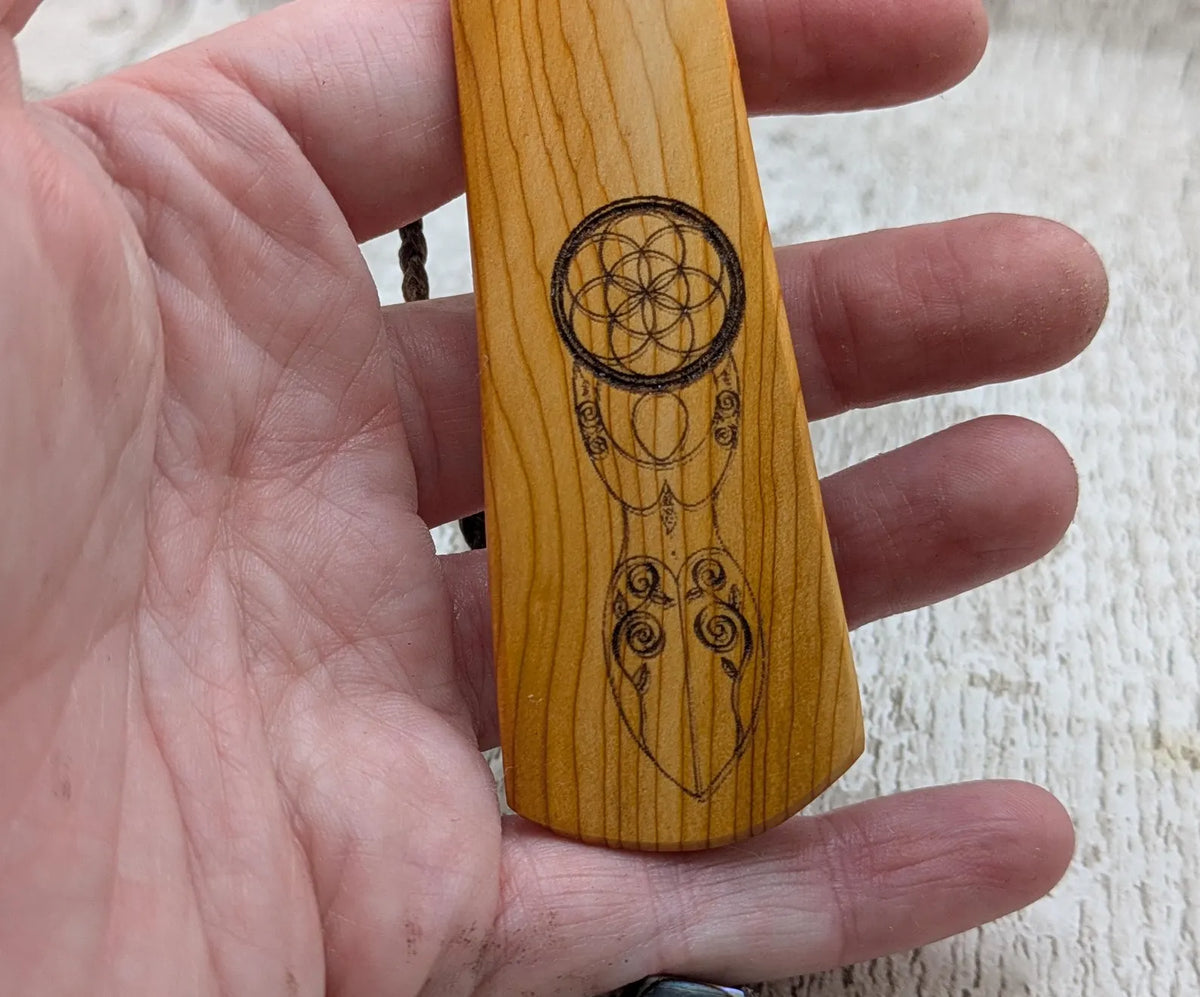 Yew wood, goddess deity laser printed bookmark with pāua shell beaded tassel.