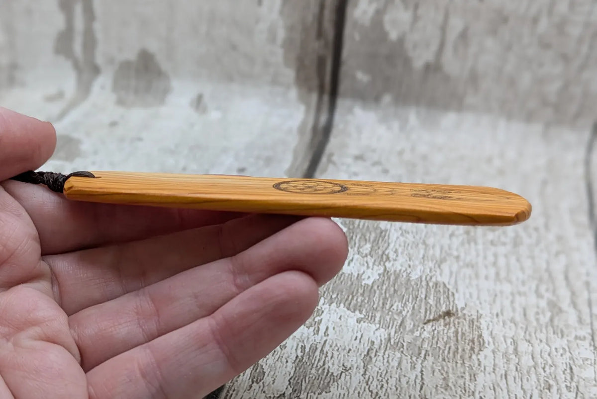 Yew wood, goddess deity laser printed bookmark with pāua shell beaded tassel.