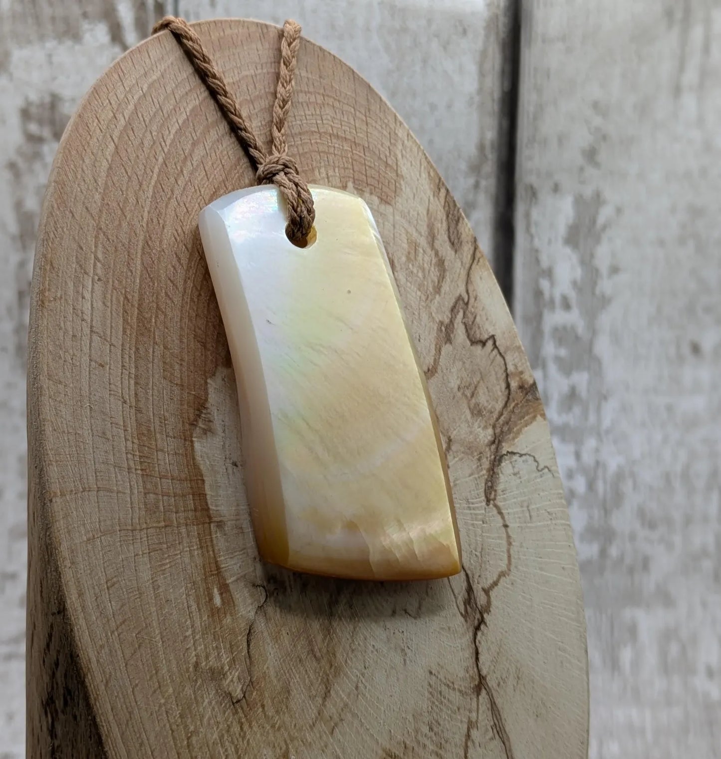 Mother of pearl shell toki styled pendant