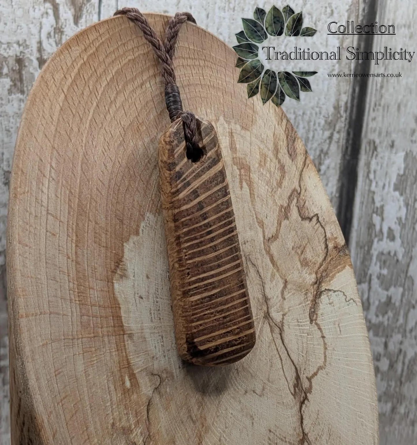 Olive wood roimata teardrop pendant.
