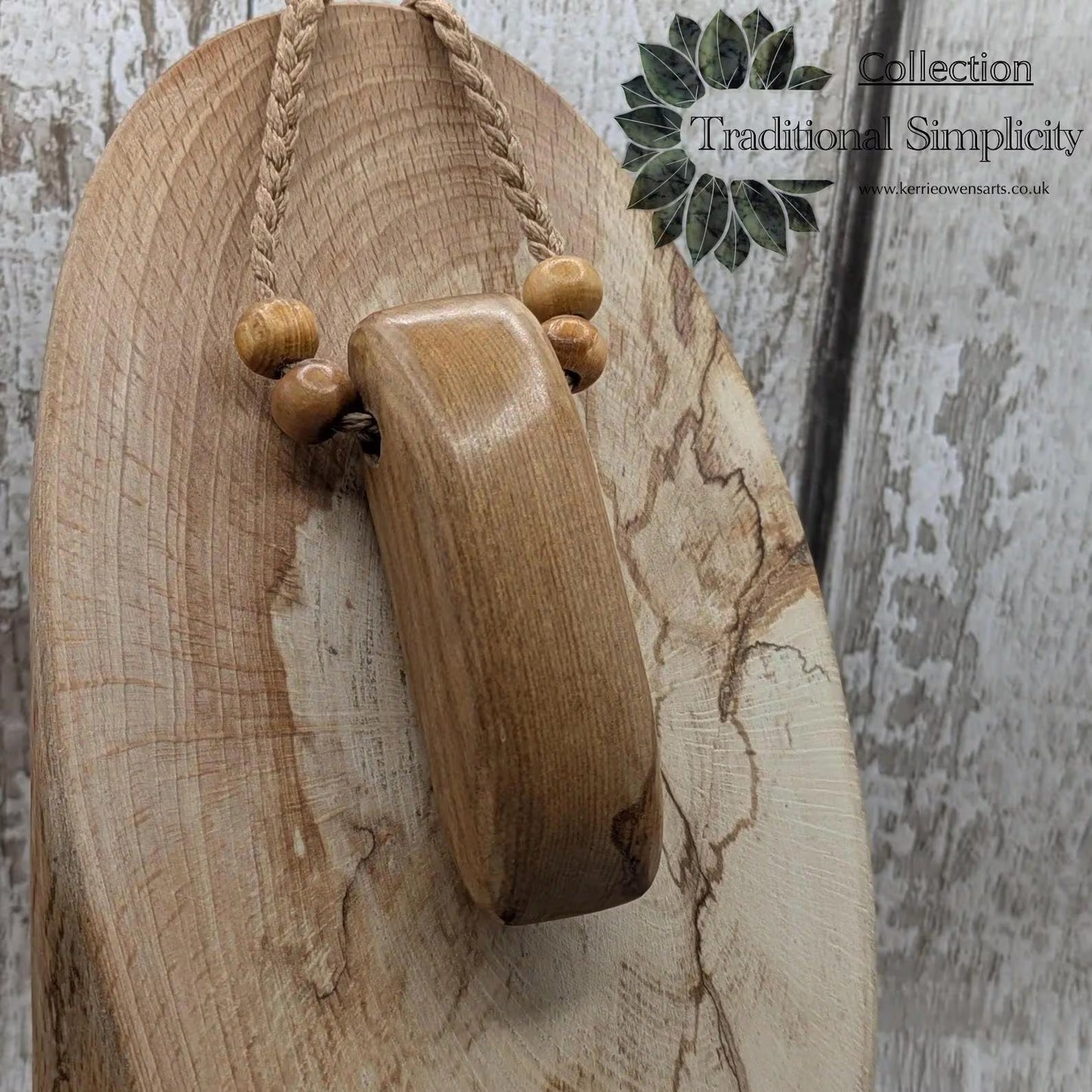 New Zealand Rimu wood adze inspired pendant.