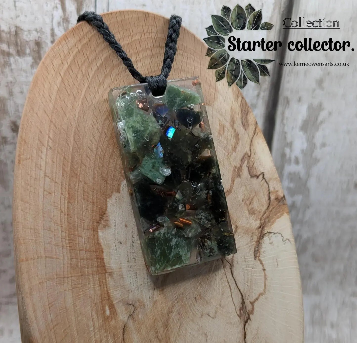 Mixed nephrite jade and copper in resin pendant.