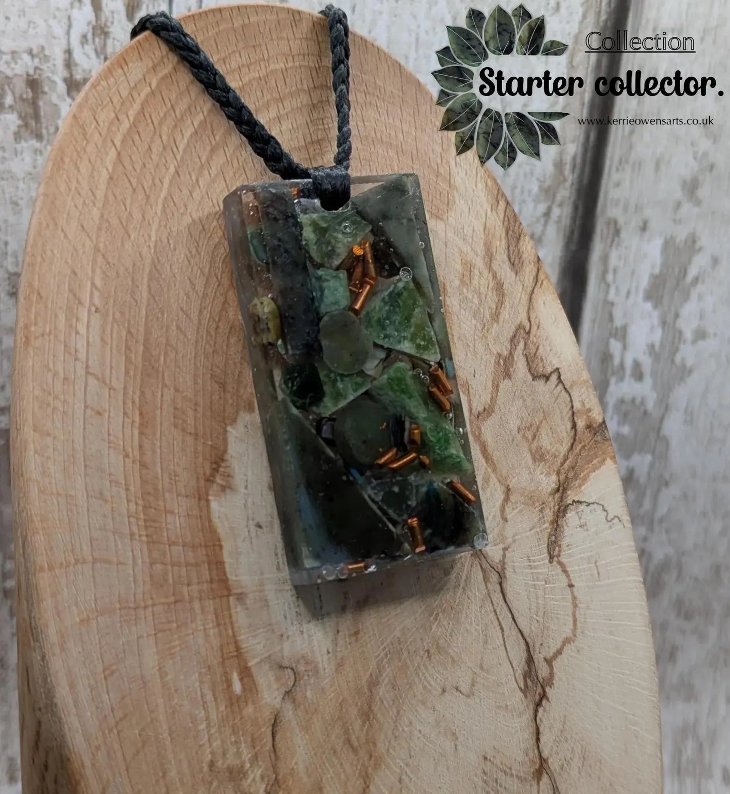 Mixed nephrite jade and copper pendant.