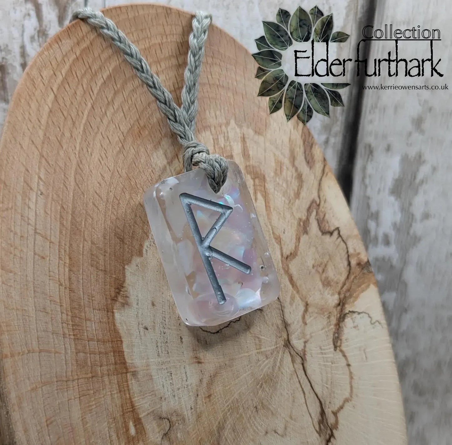 Raido rune pendant with UV resin and mussel shell.