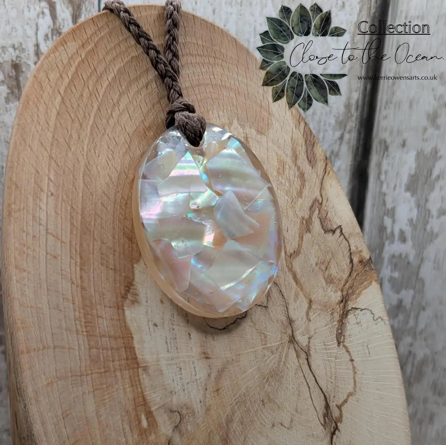 Oval mussel shell resin cast pendant.