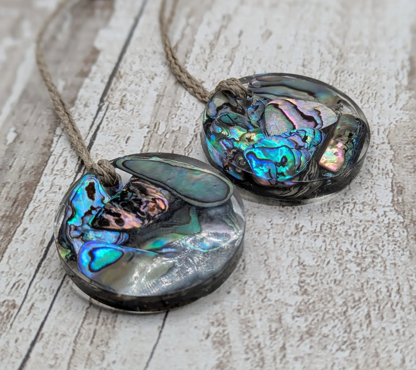 Wild New Zealand rainbow Pāua shell in epoxy resin pendant.