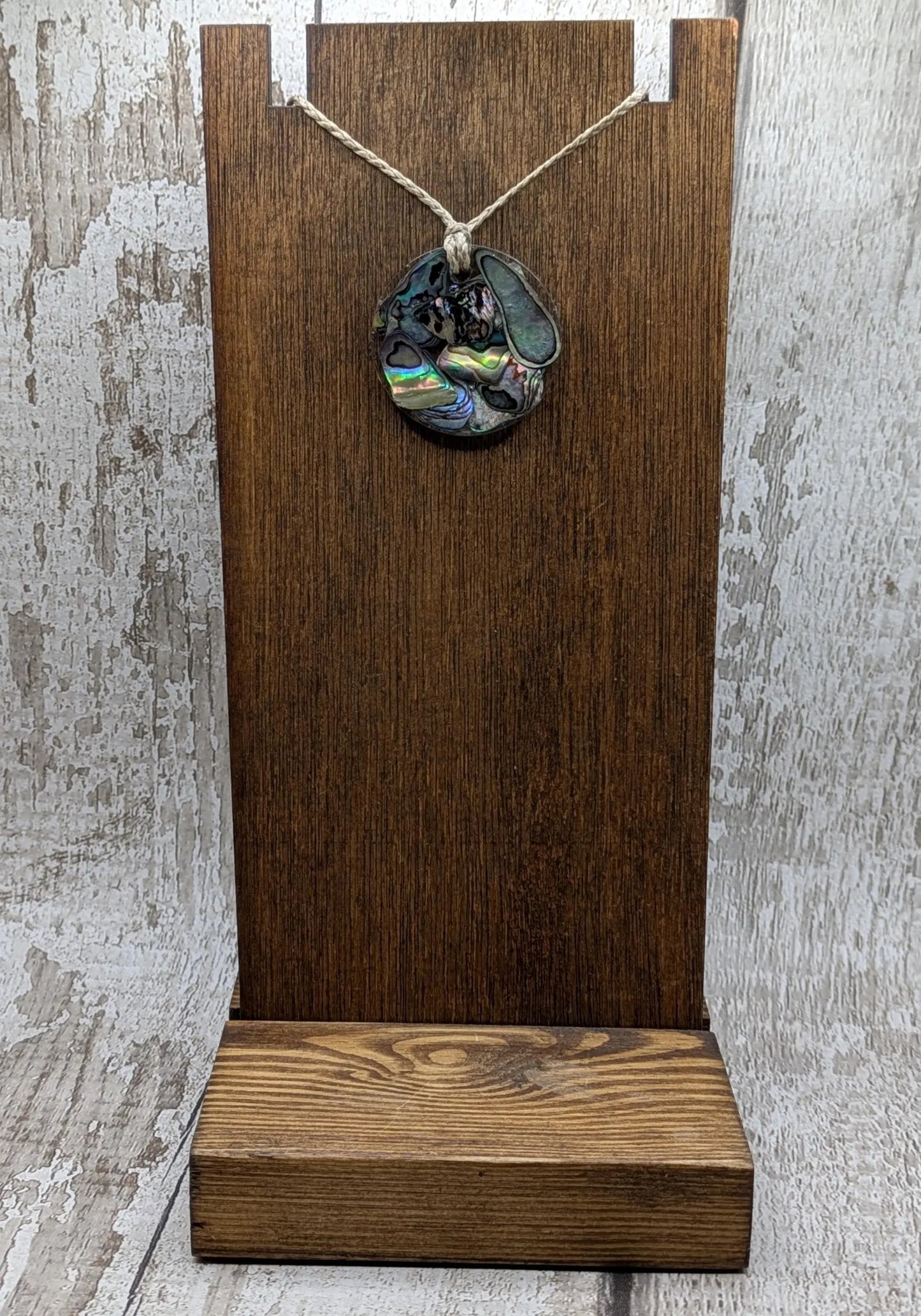 Wild New Zealand rainbow Pāua shell in epoxy resin pendant.