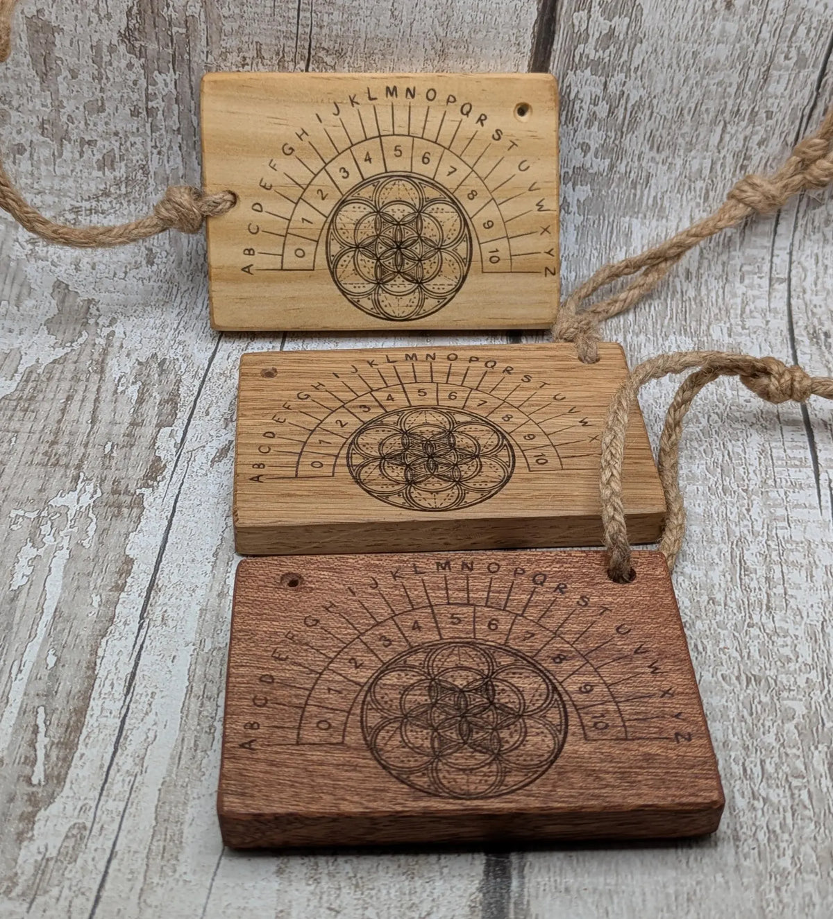 Oak wood pocket pendulum with geometric laser print. Travel sized.