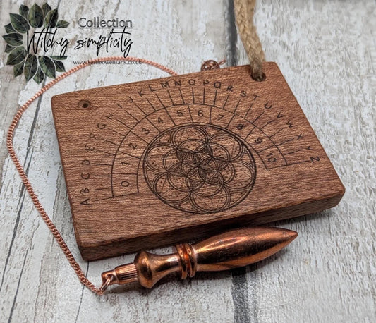 Sepele mahogany pendulum dowsing board with geometric print.