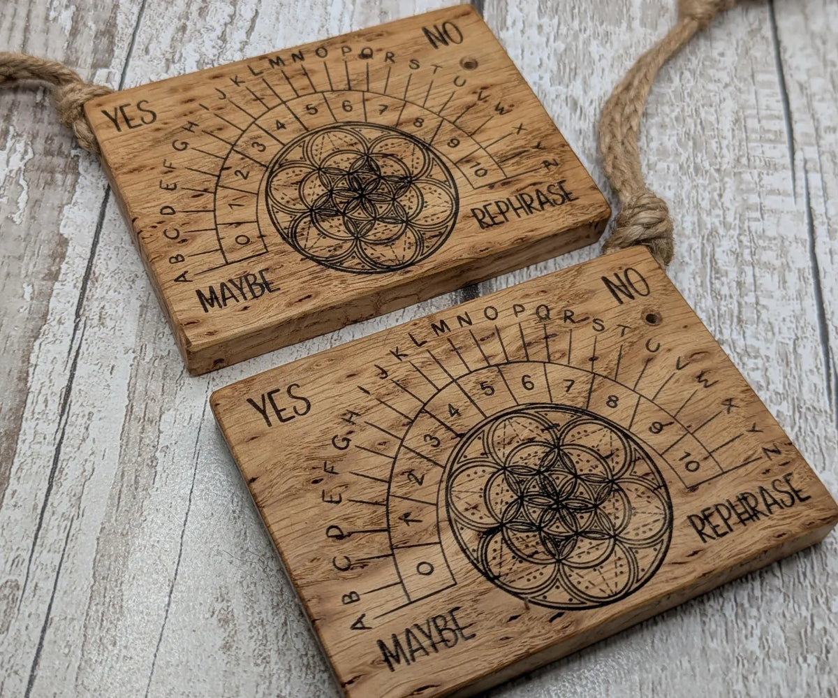 Iroko wood pocket pendulum board with geometric laser print design.