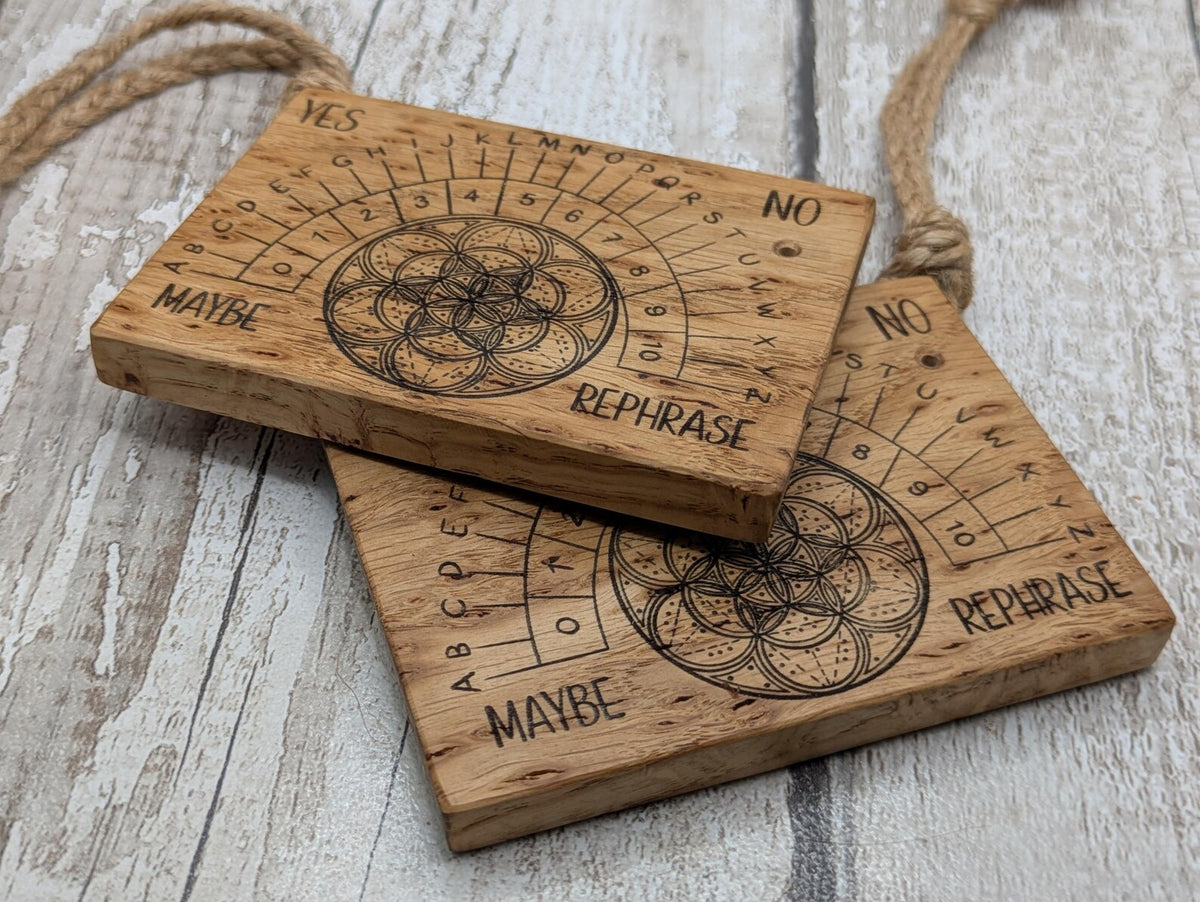 Iroko wood pocket pendulum board with geometric laser print design.