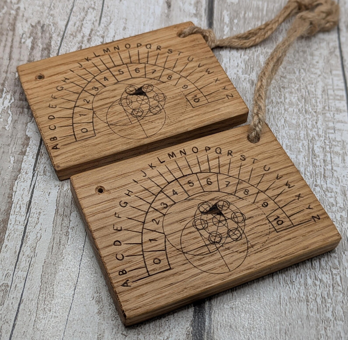 Oak wood pendulum board with Celtic geometric laser print design.
