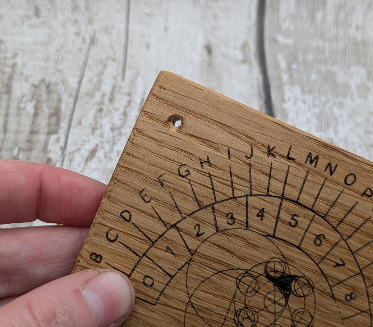 Oak wood pendulum board with Celtic geometric laser print design.