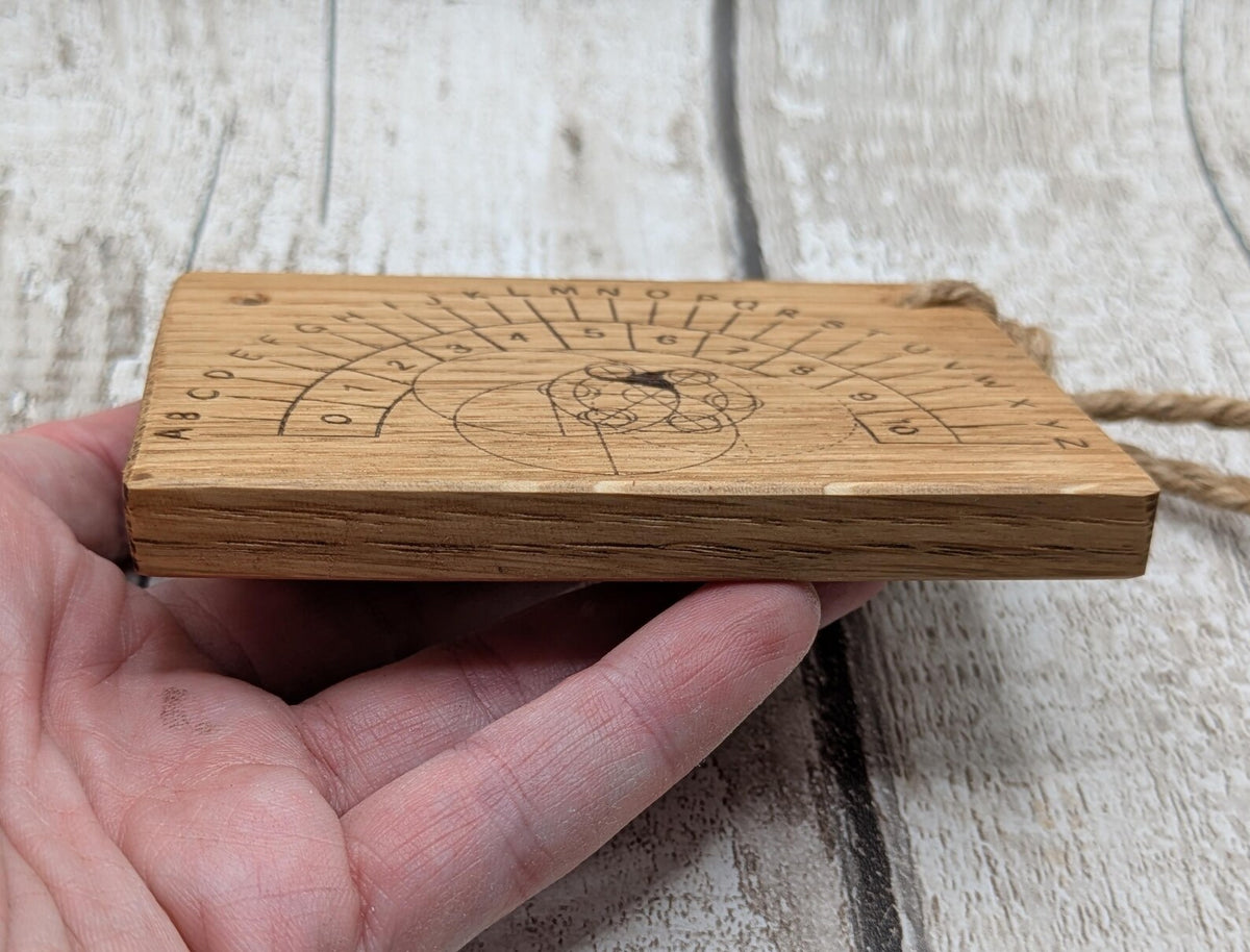 Oak wood pendulum board with Celtic geometric laser print design.