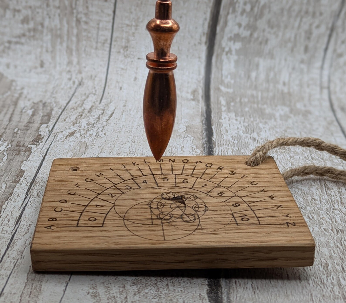 Oak wood pendulum board with Celtic geometric laser print design.