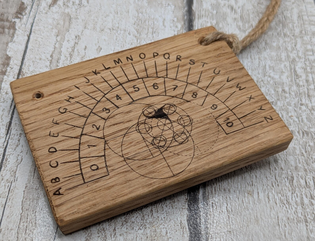 Oak wood pendulum board with Celtic geometric laser print design.