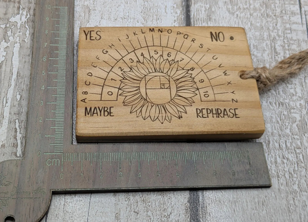 Tulip wood pendulum dowsing board with sunflower laser design.