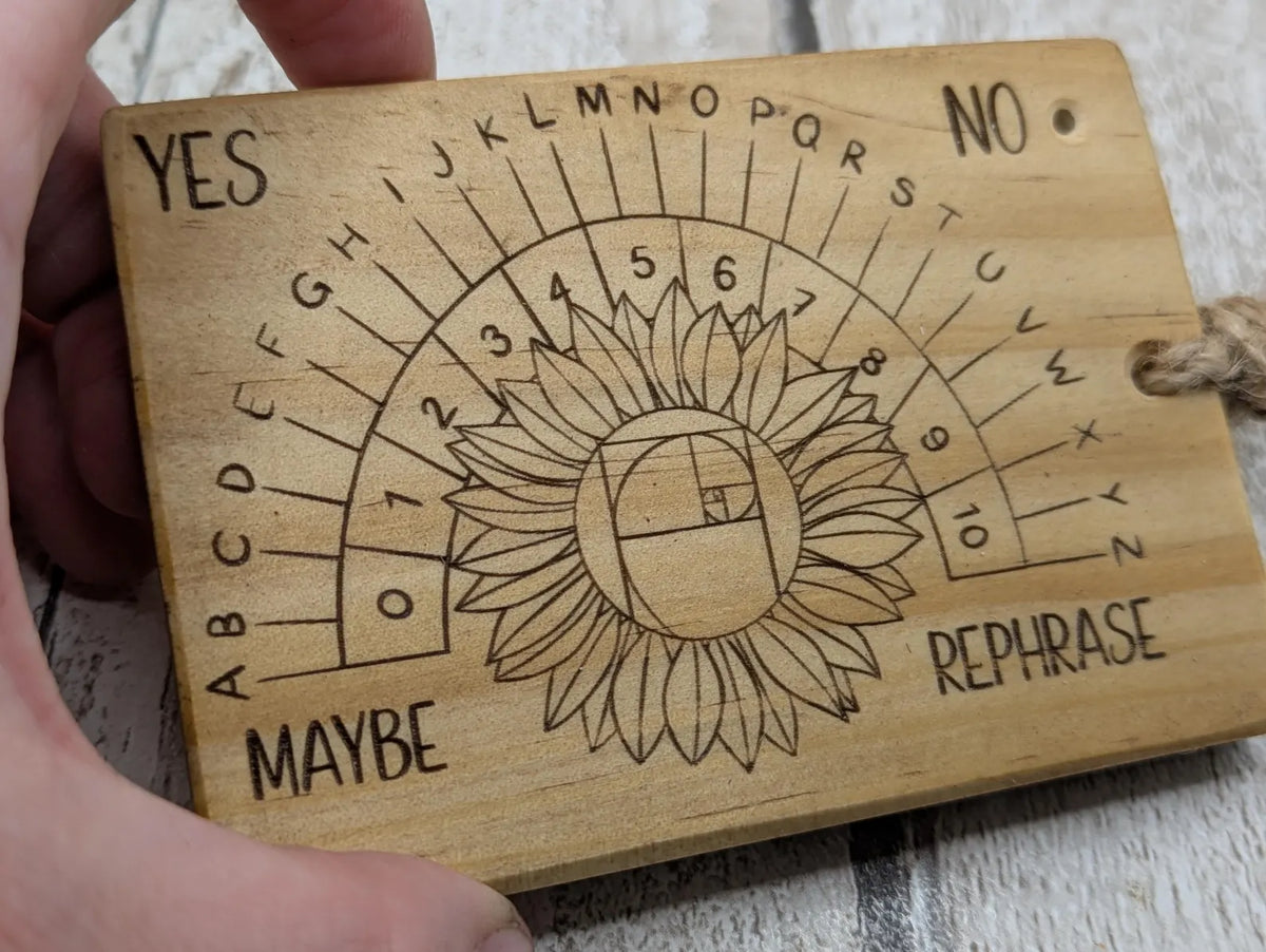 Tulip wood pendulum dowsing board with sunflower laser design.
