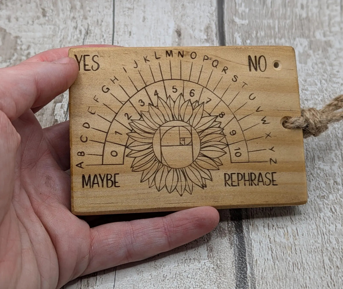 Tulip wood pendulum dowsing board with sunflower laser design.