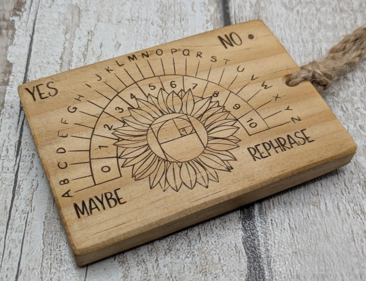 Tulip wood pendulum dowsing board with sunflower laser design.