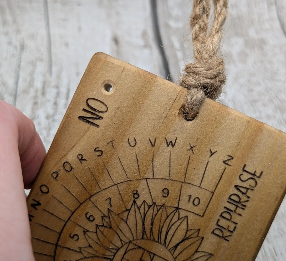 Tulip wood pendulum dowsing board with sunflower laser design.