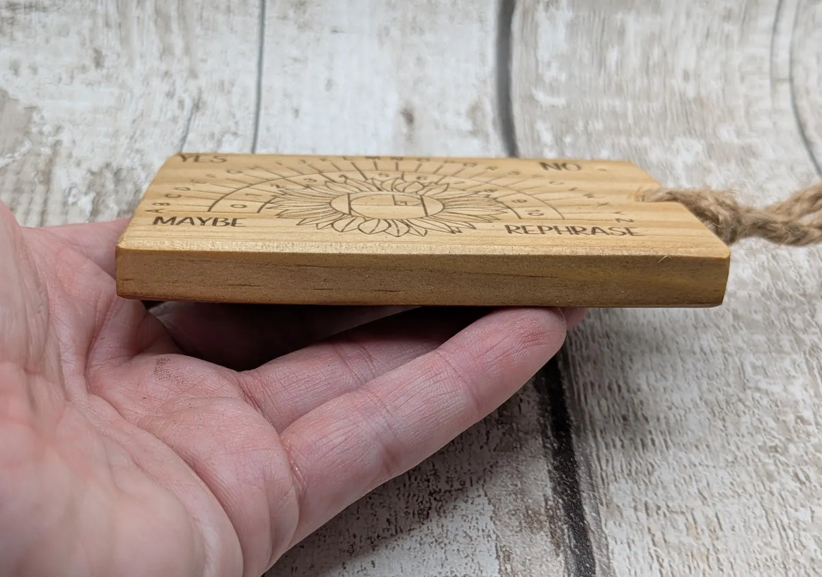 Tulip wood pendulum dowsing board with sunflower laser design.