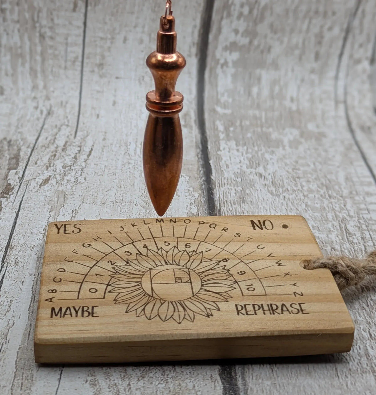 Tulip wood pendulum dowsing board with sunflower laser design.