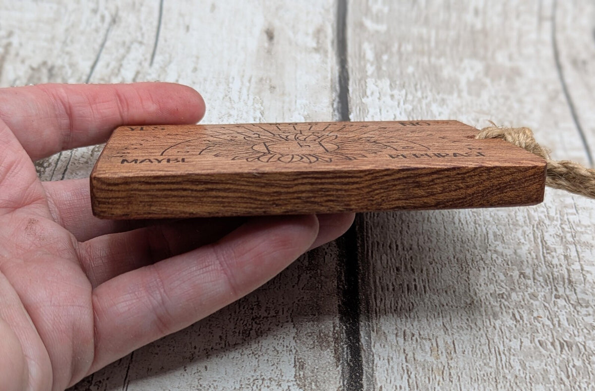 Sepele mahogany pendulum dowsing board with sunflower laser design.