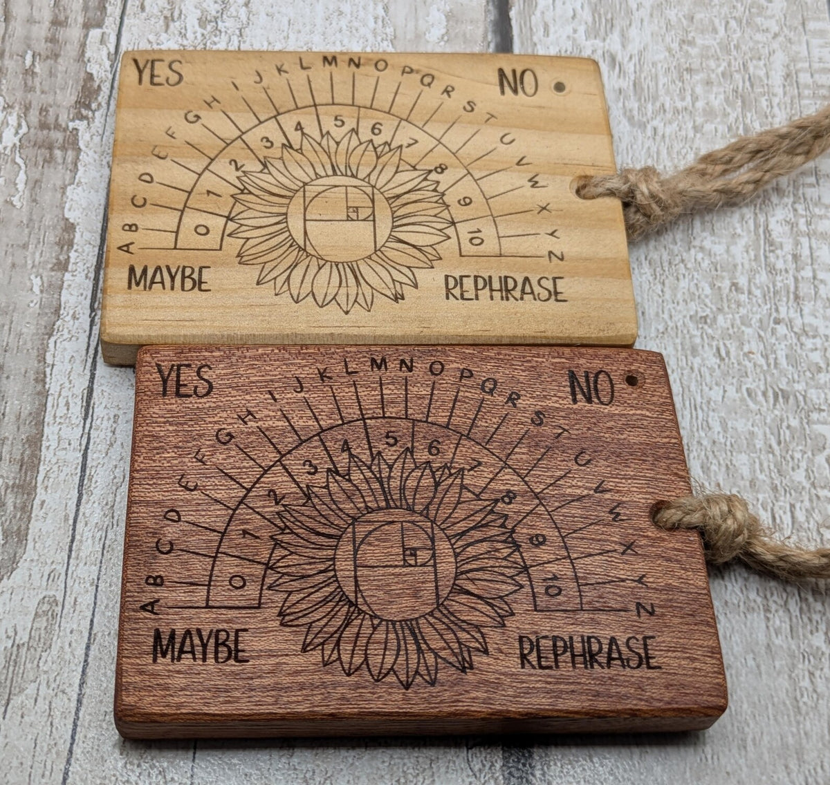Sepele mahogany pendulum dowsing board with sunflower laser design.