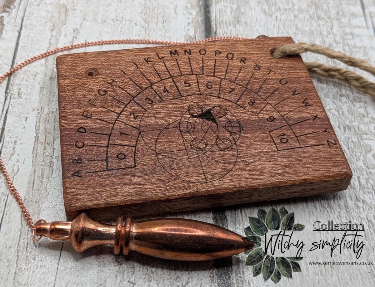 Sepele mahogany pendulum dowsing board with Celtic geometric design.
