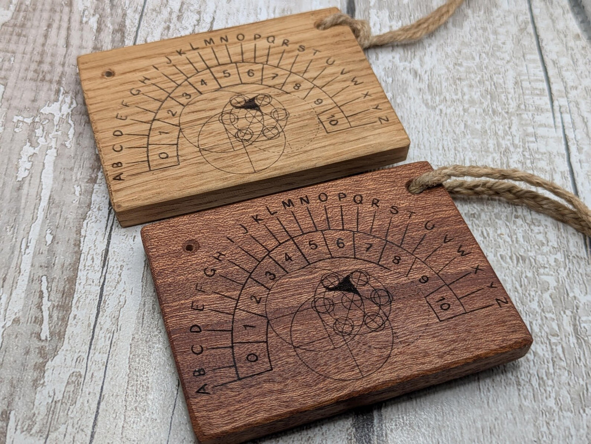 Sepele mahogany pendulum dowsing board with Celtic geometric design.