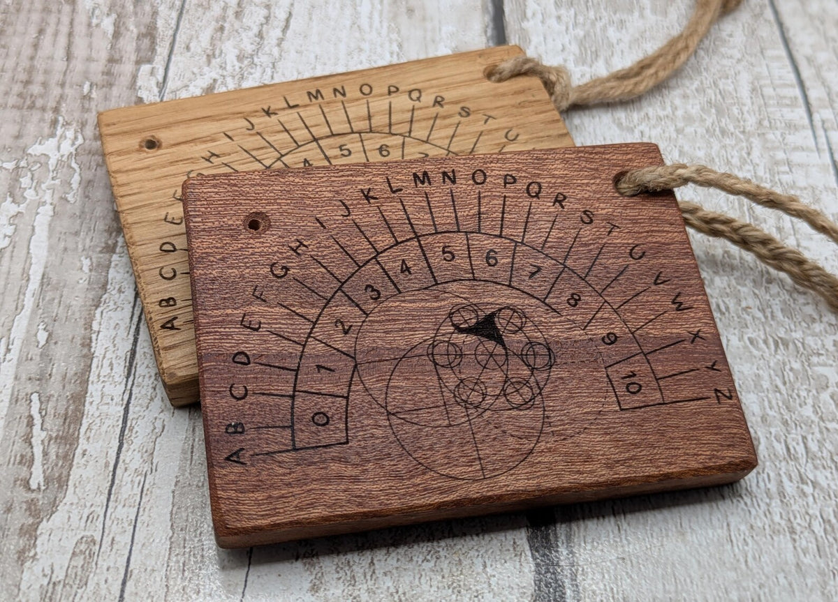 Sepele mahogany pendulum dowsing board with Celtic geometric design.