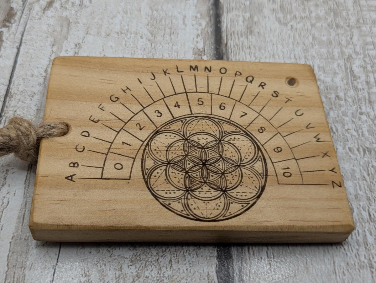 Tulip wood pendulum board with geometric laser print.