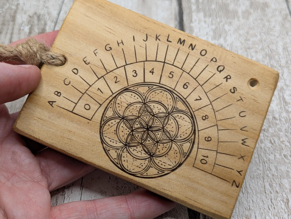 Tulip wood pendulum board with geometric laser print.