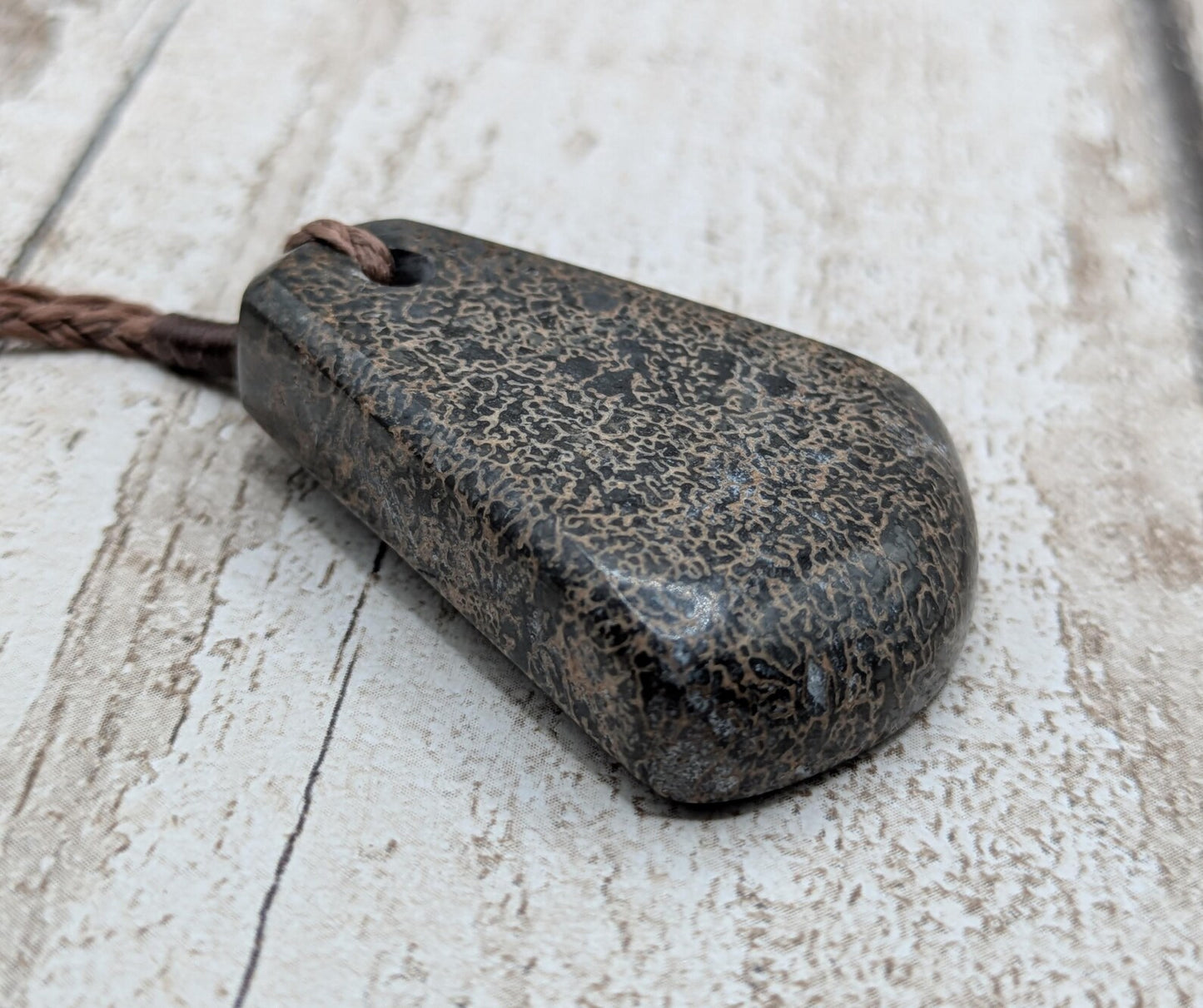 Oxfordshire dinosaur bone toki style pendant.