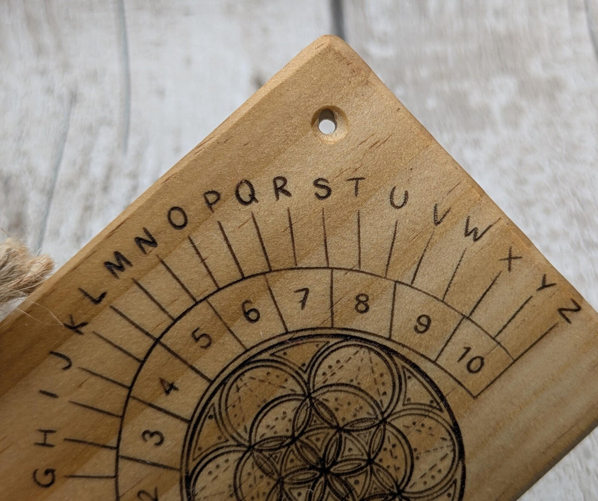 Tulip wood pendulum board with geometric laser print.