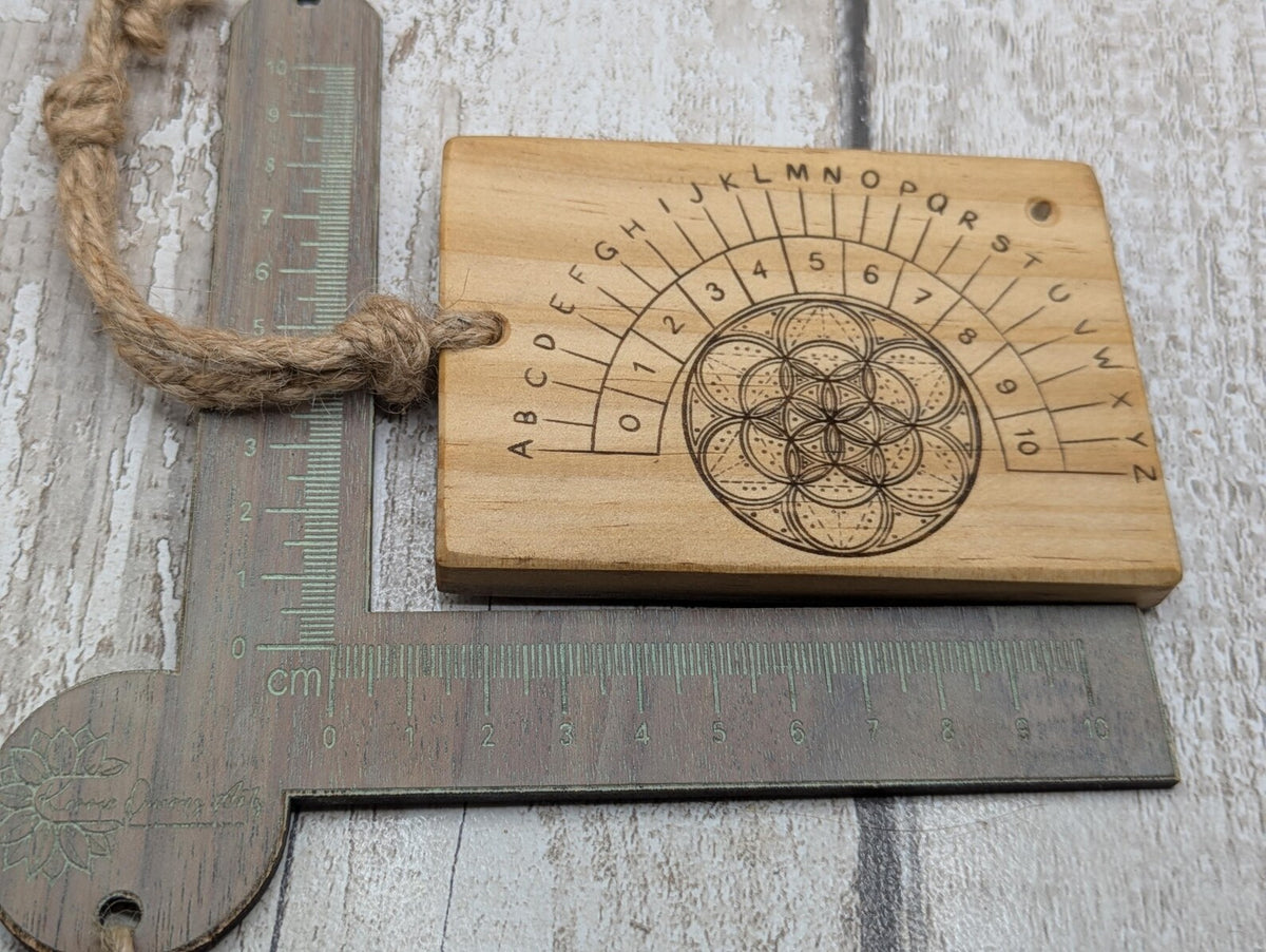 Tulip wood pendulum board with geometric laser print.