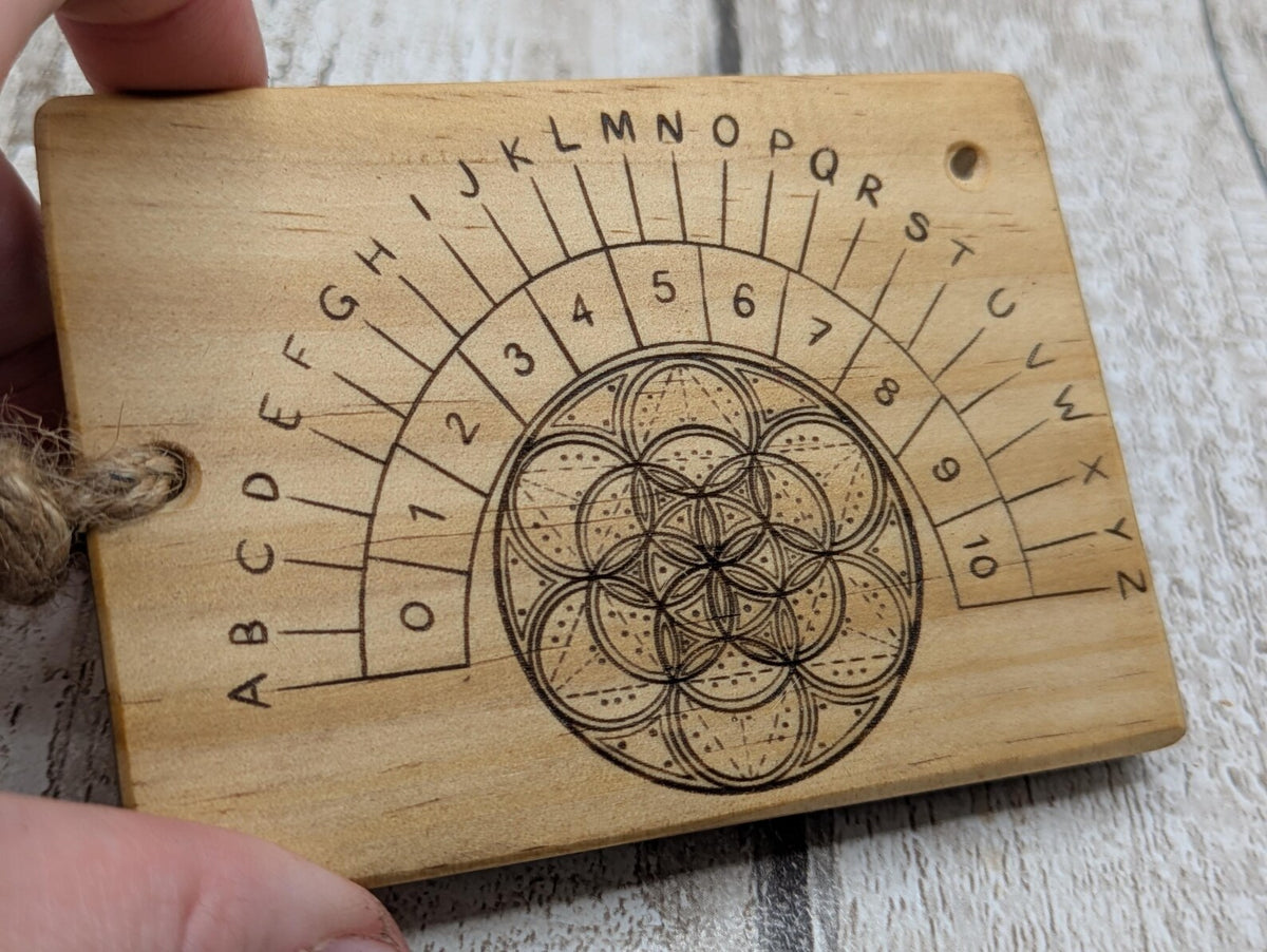 Tulip wood pendulum board with geometric laser print.